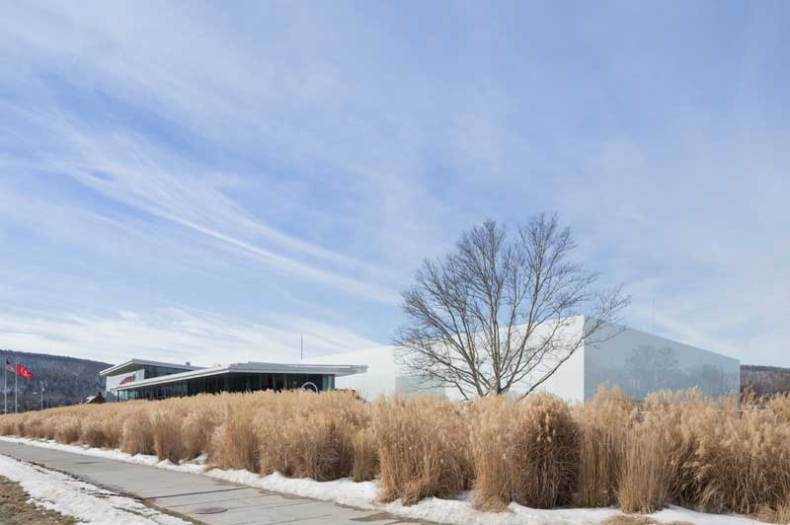 The front of the Corning Museum of Glass, featuring the new Contemporary Art + Design Wing, designed by Thomas Phifer and Associates.