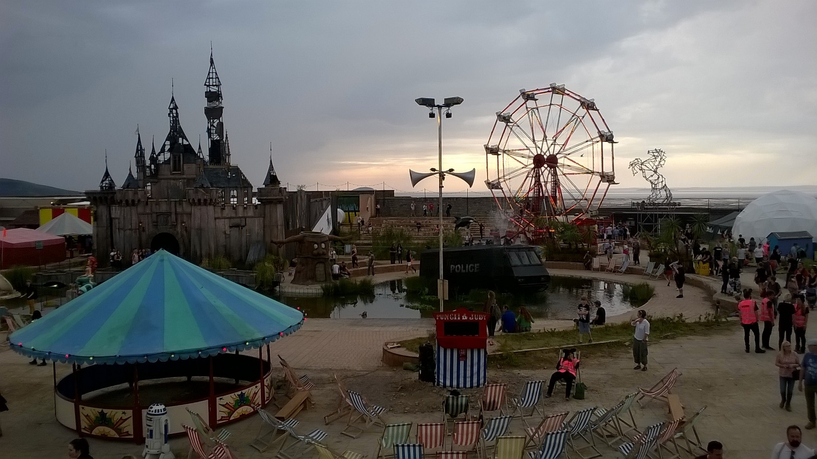 Welcome to Dismaland. Banksy surveils the state of Britain today