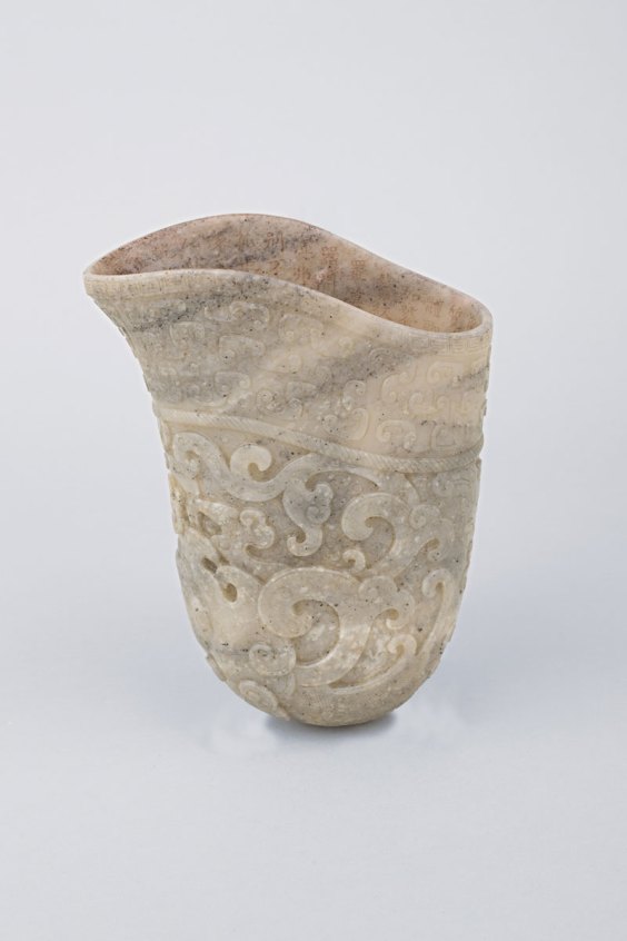 Rhyton (‘gong’ vessel), (1792), Chinese, Qianlong period (1736–95), mottled white and grey jade, ht 16cm.