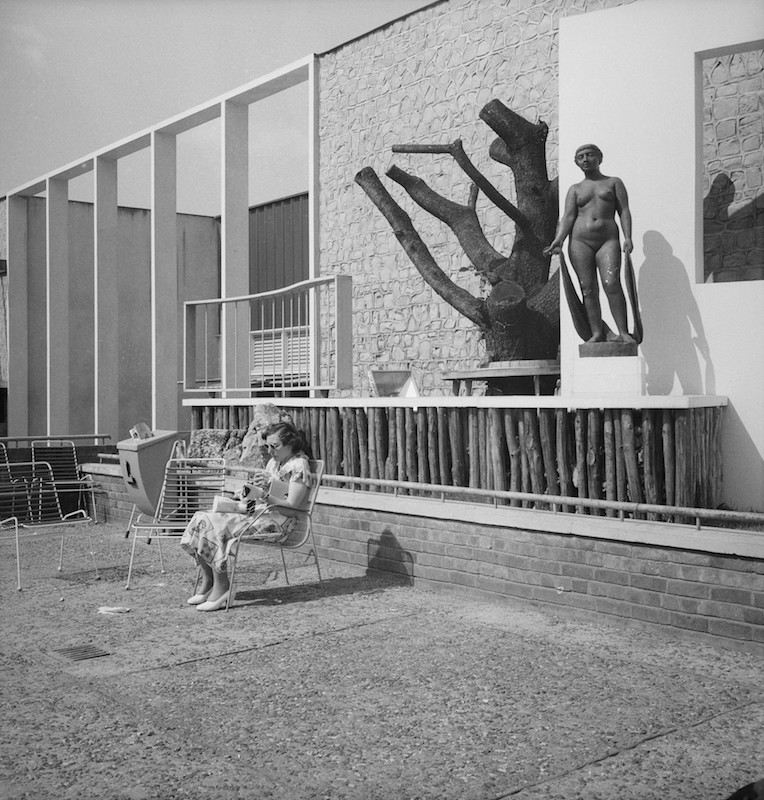 Visitor relaxing at the Festival of Britain, 1951