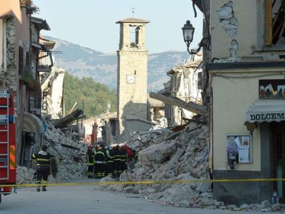 Firefighters gather near the damaged Sant'Agostino church in the central Italian village of Amatrice on 26 August, 2016, three days after a 6.2-magnitude earthquake struck the region. ANDREAS SOLARO/AFP/Getty Images
