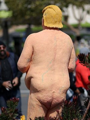 People gather around a statue depicting republican presidential nominee Donald Trump in the nude on 18 August, 2016 in San Francisco, United States. Anarchist collective INDECLINE created five statues depicting Donald Trump in the nude and placed them in five U.S. cities: San Francisco, New York, Los Angeles, Cleveland and Seattle. Justin Sullivan/Getty Images