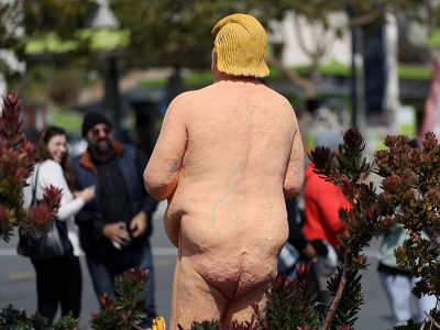 People gather around a statue depicting republican presidential nominee Donald Trump in the nude on 18 August, 2016 in San Francisco, United States. Anarchist collective INDECLINE created five statues depicting Donald Trump in the nude and placed them in five U.S. cities: San Francisco, New York, Los Angeles, Cleveland and Seattle. Justin Sullivan/Getty Images