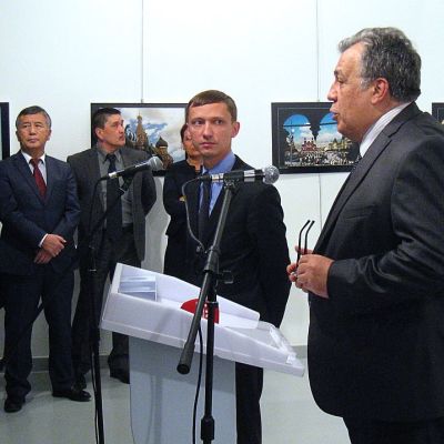 Andrei Karlov (R), the Russian ambassador to Ankara, gives a speech before being shot by a gunman (unseen) during an art exhibition in Ankara. Photo: UGUR KAVAS/AFP/Getty Images