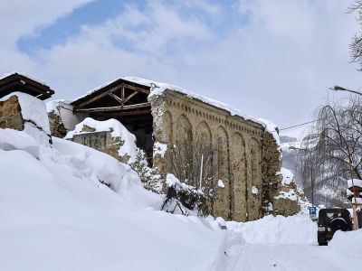 Italian military vehicles stand guard in front a Sant'Agostino church in Amatrice on January 19, 2017 after a 5.7-magnitude earthquake struck the region. The church was severely damaged in a major quake in August 2016. ANDREAS SOLARO/AFP/Getty Images