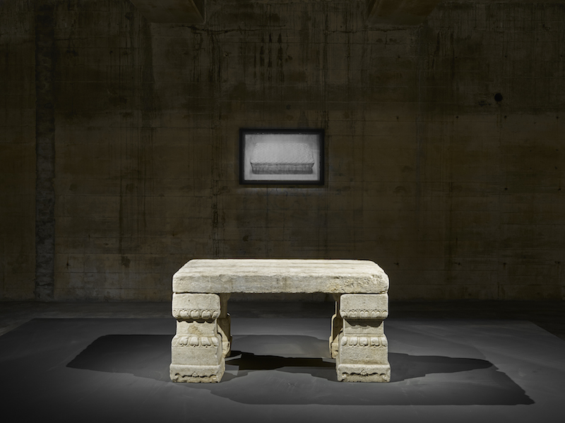 A 2010 daguerreotype by Adam Fuss hangs above a Chinese imperial stone table from the early Qing dynasty (17th century), installation view, Feuerle Collection, Berlin. Photo: def image; © The Feuerle Collection