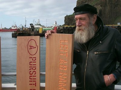 Lawrence Weiner about to leave port in Reykjavik to jettison his planks A PURSUIT OF HAPPINESS ASAP as his participation in Reykjavik Arts Festival, Iceland, 2005. © Lawrence Weiner