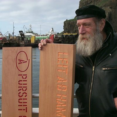 Lawrence Weiner about to leave port in Reykjavik to jettison his planks A PURSUIT OF HAPPINESS ASAP as his participation in Reykjavik Arts Festival, Iceland, 2005. © Lawrence Weiner