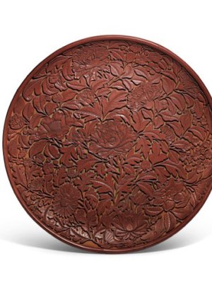 Carved cinnabar lacquer dish (Lat Yuan/early Ming dynasty), China. Sotheby's.
