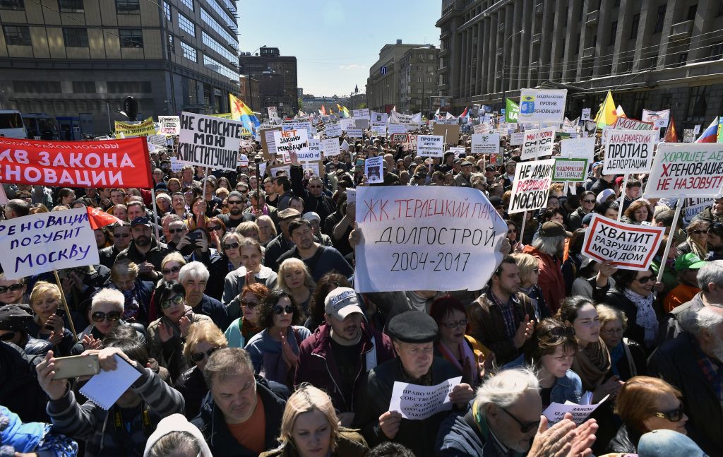 Demonstrators march during a protest in Moscow on 14 May, 2017, against the city's controversial plan to knock down Soviet-era apartment blocks and redevelop the old neighbourhoods. ALEXANDER NEMENOV/AFP/Getty Images