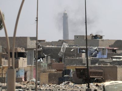 A general view shows smoke rising near the leaning Al-Hadba minaret in the Al-Nuri mosque compound, as Iraqi government forces advance in western Mosul's Zanjili neighbourhood on 7 June, 2017, during ongoing battles against Islamic State (IS) group fighters. Photo: KARIM SAHIB/AFP/Getty Images