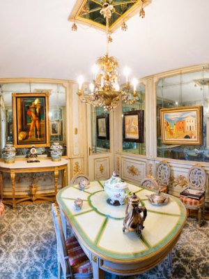 Paintings by De Chirico hang in the mirrored dining room of Francesco Federico Cerruti's villa. Photo: Gabriele Gaidano