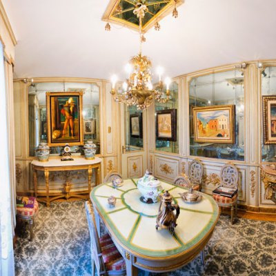 Paintings by De Chirico hang in the mirrored dining room of Francesco Federico Cerruti's villa. Photo: Gabriele Gaidano