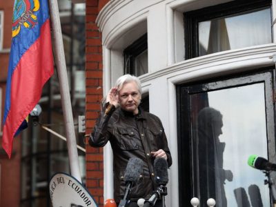Julian Assange gestures as he speaks to the media from the balcony of the Embassy Of Ecuador on May 19, 2017 in London, England. Photo by Jack Taylor/Getty Images