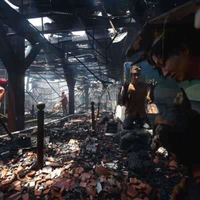 Indonesian firefighters working to extinguish a fire inside the 17th-century Dutch colonial building maritime museum in Jakarta on 16 January 2018.