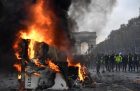 A burnt-out truck on the Champs Elysees in Paris, BERTRAND GUAY/AFP/Getty Images