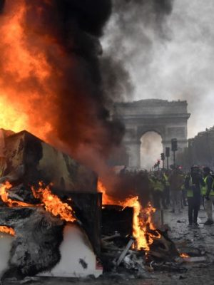 A burnt-out truck on the Champs Elysees in Paris, BERTRAND GUAY/AFP/Getty Images