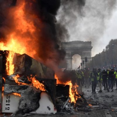 A burnt-out truck on the Champs Elysees in Paris, BERTRAND GUAY/AFP/Getty Images