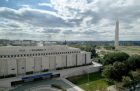 The Smithsonian's National Museum of American History, Kenneth E. Behring Center in Washington, D.C., with the Washington Monument and National Mall in the background.