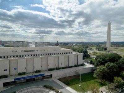 The Smithsonian's National Museum of American History, Kenneth E. Behring Center in Washington, D.C., with the Washington Monument and National Mall in the background.