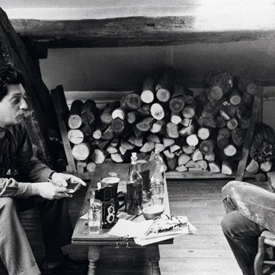 Jean-Paul Riopelle and Joan Mitchell photographed in their apartment-studio on Rue Frémicourt, Paris in 1963.