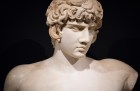 Bust of Antinous with Greek inscription, (AD 130–138), discovered in Balanea, Syria in 1879. Private collection