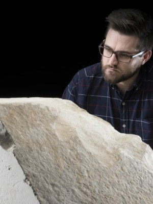 Daniel Potter, assistant curator at National Museum of Scotland, with a casing stone from the Great Pyramid of Giza.