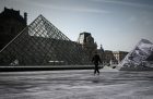 Jean Rene, aka JR walks in the Cour Napoleon of the Louvre Museum as part of the 30th anniversary celebrations of the Louvre Pyramid, Photo: Philippe Lopez/AFP/Getty Images