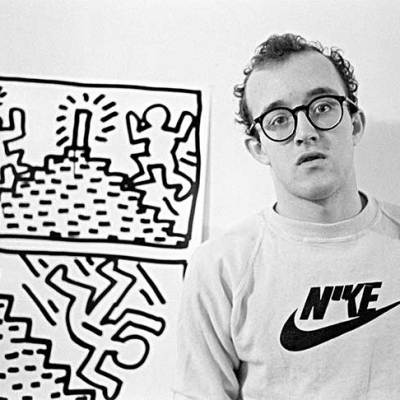 Keith Haring with one of his drawing series, photographed in January 1982 by Joseph Szkodzinski.