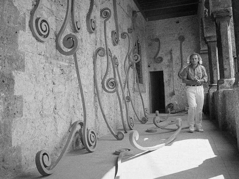 Eliseo Mattiacci with an installation of his Roma sculptures at the Palazzo Mazzancolli, Italy, in 1982.
