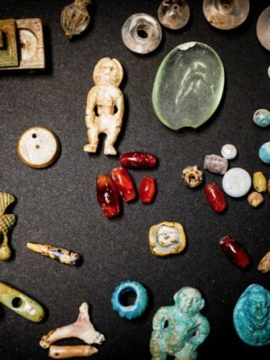 Some of the figurines and gems recently excavated in the House of the Garden at Pompeii.