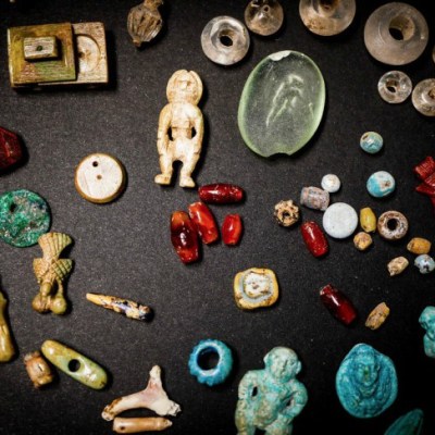 Some of the figurines and gems recently excavated in the House of the Garden at Pompeii.