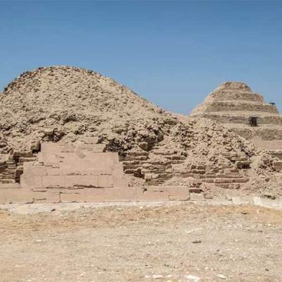 The pyramids in the Saqqara necropolis, with the Pyramid of Unas in the foreground and the Step Pyramid of Djoser in the background.