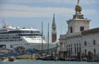 A cruise ship passes close to the church San Giorgio Maggiore, in Venice on 26 September 2014.