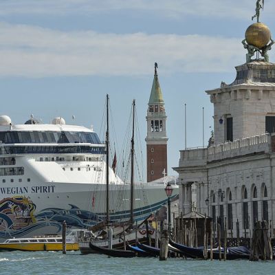 A cruise ship passes close to the church San Giorgio Maggiore, in Venice on 26 September 2014.
