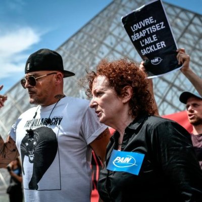 Nan Goldin at a P.A.I.N. protest in front of the Louvre in July 2019.