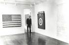 Leo Castelli in a room of the Jasper Johns exhibit at the Castelli Gallery, New York, 1958. Archives of American Art, Smithsonian Institution