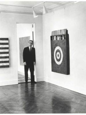 Leo Castelli in a room of the Jasper Johns exhibit at the Castelli Gallery, New York, 1958. Archives of American Art, Smithsonian Institution