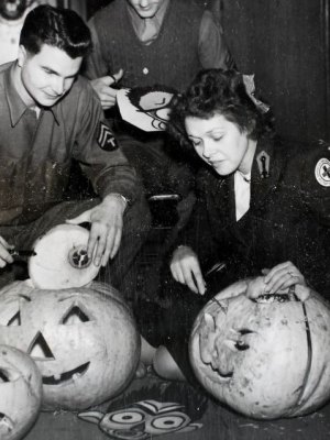 American Red Cross workers hollowing out pumpkins in preparation for a Halloween Dance at Cheltenham Town Hall in 1944.