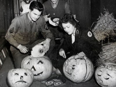 American Red Cross workers hollowing out pumpkins in preparation for a Halloween Dance at Cheltenham Town Hall in 1944.
