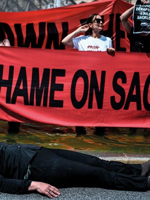 Nan Goldin protesting with P.A.I.N. in the courtyard of the Louvre in July 2019.