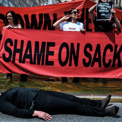 Nan Goldin protesting with P.A.I.N. in the courtyard of the Louvre in July 2019.