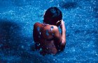 The young Susi Korihana Theri swimming, infrared film, Catrimani, Roraima (1972–74), Claudia Andujar.