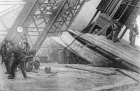 Workmen riveting the bases of the Eiffel Tower in place using hydraulic power in c. 1888.