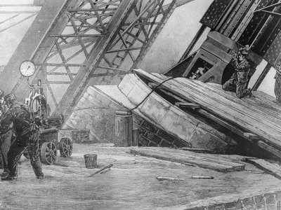 Workmen riveting the bases of the Eiffel Tower in place using hydraulic power in c. 1888.