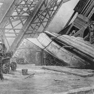 Workmen riveting the bases of the Eiffel Tower in place using hydraulic power in c. 1888.