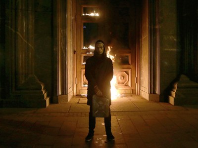 Russian artist Pyotr Pavlensky poses after setting fire to the doors of the headquarters of the FSB security service, the successor to the KGB, in central Moscow early on November 9, 2015. Photo by NIGINA BEROEVA/AFP via Getty Images