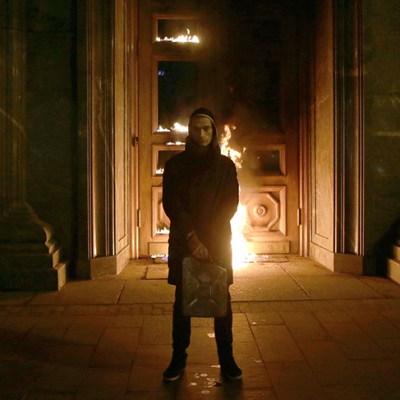 Russian artist Pyotr Pavlensky poses after setting fire to the doors of the headquarters of the FSB security service, the successor to the KGB, in central Moscow early on November 9, 2015. Photo by NIGINA BEROEVA/AFP via Getty Images