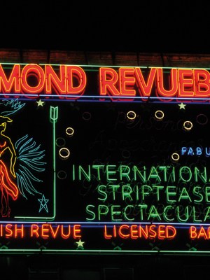Neon sign made in the 1950s for Raymond Revuebar in Soho, London, photographed in 2015 after restoration and reinstallation.