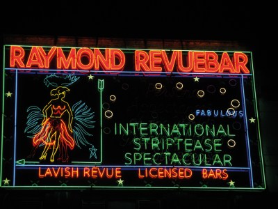 Neon sign made in the 1950s for Raymond Revuebar in Soho, London, photographed in 2015 after restoration and reinstallation.